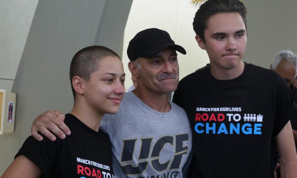 Parkland survivors-turned-activists Emma González and David Hogg stand with Mitch Dworet, father of Parkland victim Nicholas Dworet.