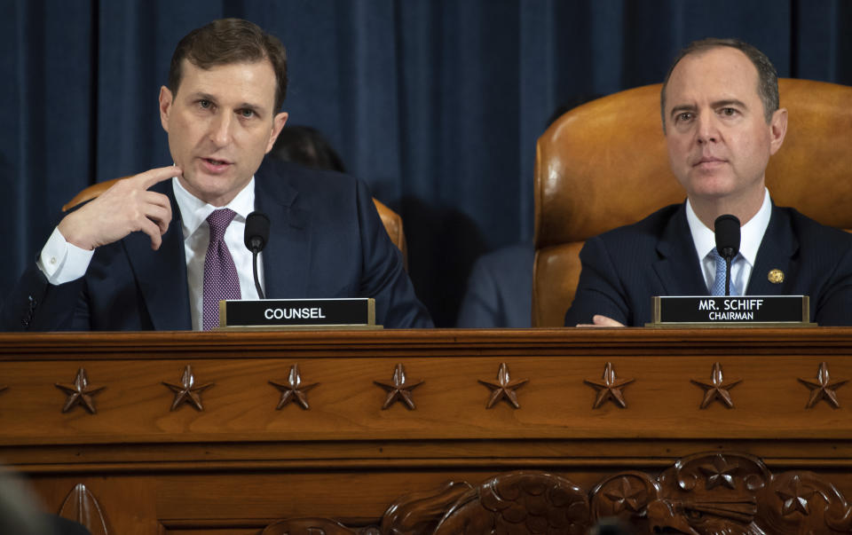 Daniel Goldman, director of investigations for the House Intelligence Committee majority staff, left, asks questions to top U.S. diplomat in Ukraine William Taylor and career Foreign Service officer George Kent, as they testify before the House Intelligence Committee on Capitol Hill in Washington, Wednesday, Nov. 13, 2019, during the first public impeachment hearing of President Donald Trump's efforts to tie U.S. aid for Ukraine to investigations of his political opponents. House Intelligence Committee Chairman Rep. Adam Schiff, D-Calif., right, looks on. (Saul Loeb/Pool Photo via AP)