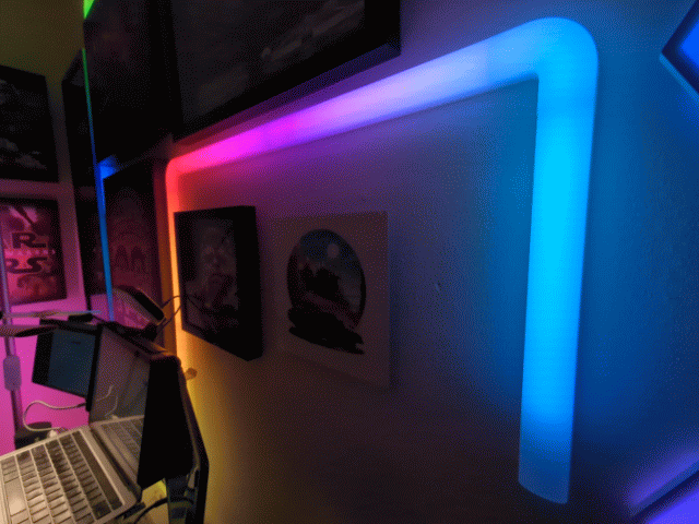 GIF of Govee Glide Wall Lights in action and changing colors.
