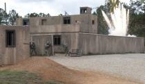 Soldiers with U.S. Army B Company, 2nd Battalion, 14th Infantry Regiment, 10th Mountain Division, storm a building within the mock village of Turani after taking fire during a training exercise alongside Afghan National Army and Afghan Uniformed Police role-players at the Joint Readiness Training Center in Fork Polk, Louisiana, U.S. on March 19, 2012. Courtesy Michael Crawford/U.S. Army/Handout via REUTERS