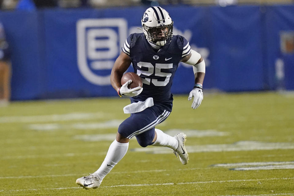 BYU running back Tyler Allgeier (25) carries the ball against Texas State in the first half during an NCAA college football game Saturday, Oct. 24, 2020, in Provo, Utah. (AP Photo/Rick Bowmer)