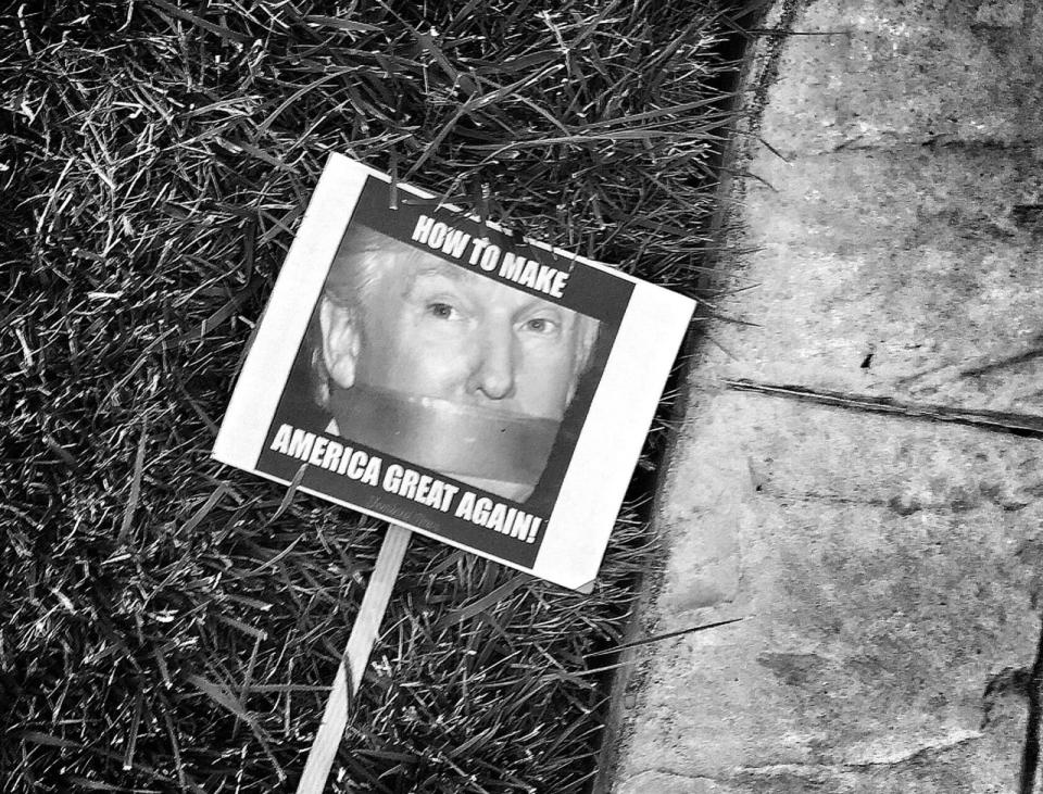 <p>An anti-Trump sign on the ground outside a Trump campaign rally in Cincinnati, Ohio. (Photo: Holly Bailey/Yahoo News) </p>