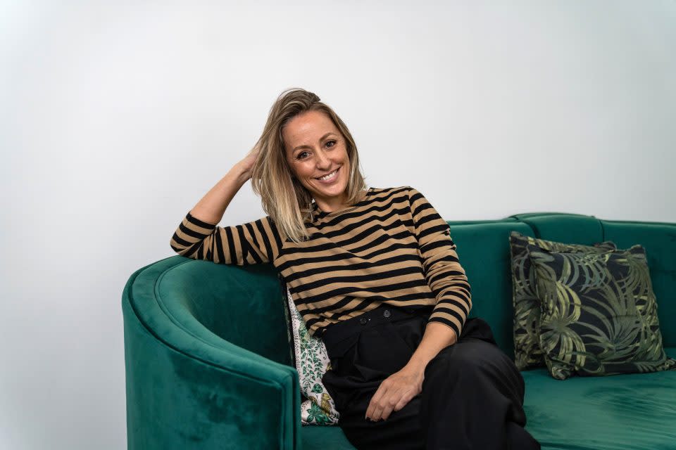 a woman sitting in a couch