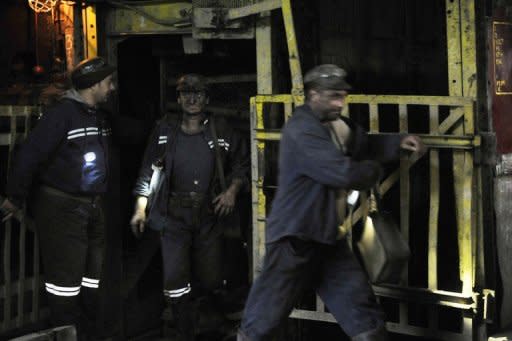 Miners return to the surface after a six hour night shift in a mine in Petrila, central Romania. The recovery in Romania's economy after two years of severe recession is now coming under threat, analysts warn, victim to the months-long political crisis that has engulfed the EU country