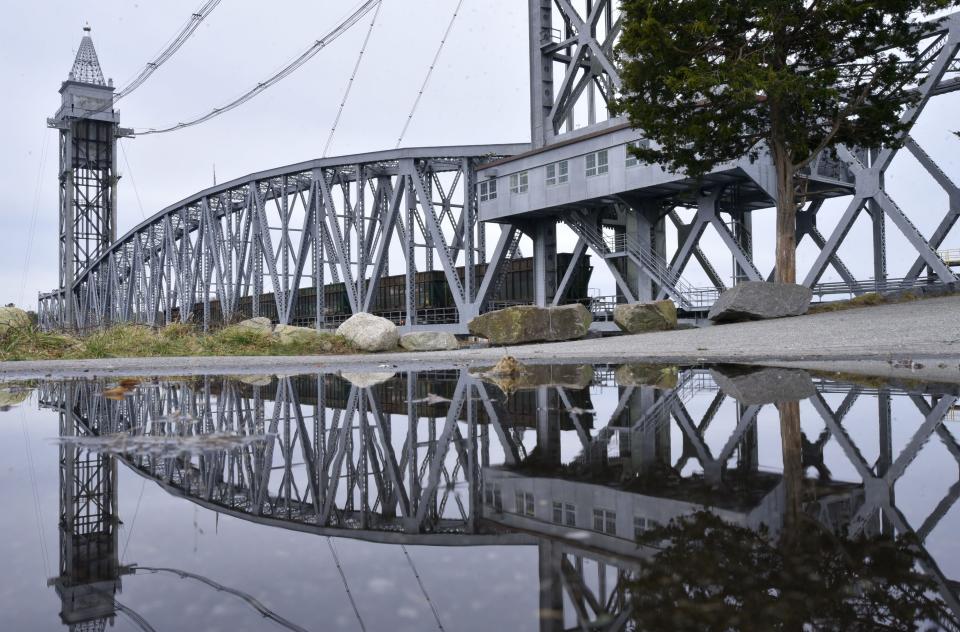 A train heads over the Cape Cod Canal via the lowered Railroad Bridge in Buzzards Bay. Standing on the walkway beside the canal, it is exciting to watch trains coming over the bridge.