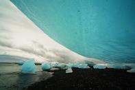 Ice chunks fall off a glacier in Jokulsarlon, Iceland. They are washed into the ocean, then thrown back onto the black beach. <br><br>Camera: Canon 5D <br><br>Doran Talmi, Israel <br><br>Special Mention, Natural Elements