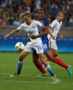 <p>United States’ Morgan Brian, left, fights for the ball with France’s Maire Laure Delie during a group G match of the women’s Olympic football tournament between United States and France at the Mineirao stadium in Belo Horizonte, Brazil, Saturday, Aug. 6, 2016. (AP Photo/Eugenio Savio) </p>