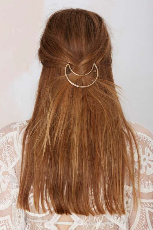 For a unique twist pull some side strands back and secure with a uber cool hair brooch.