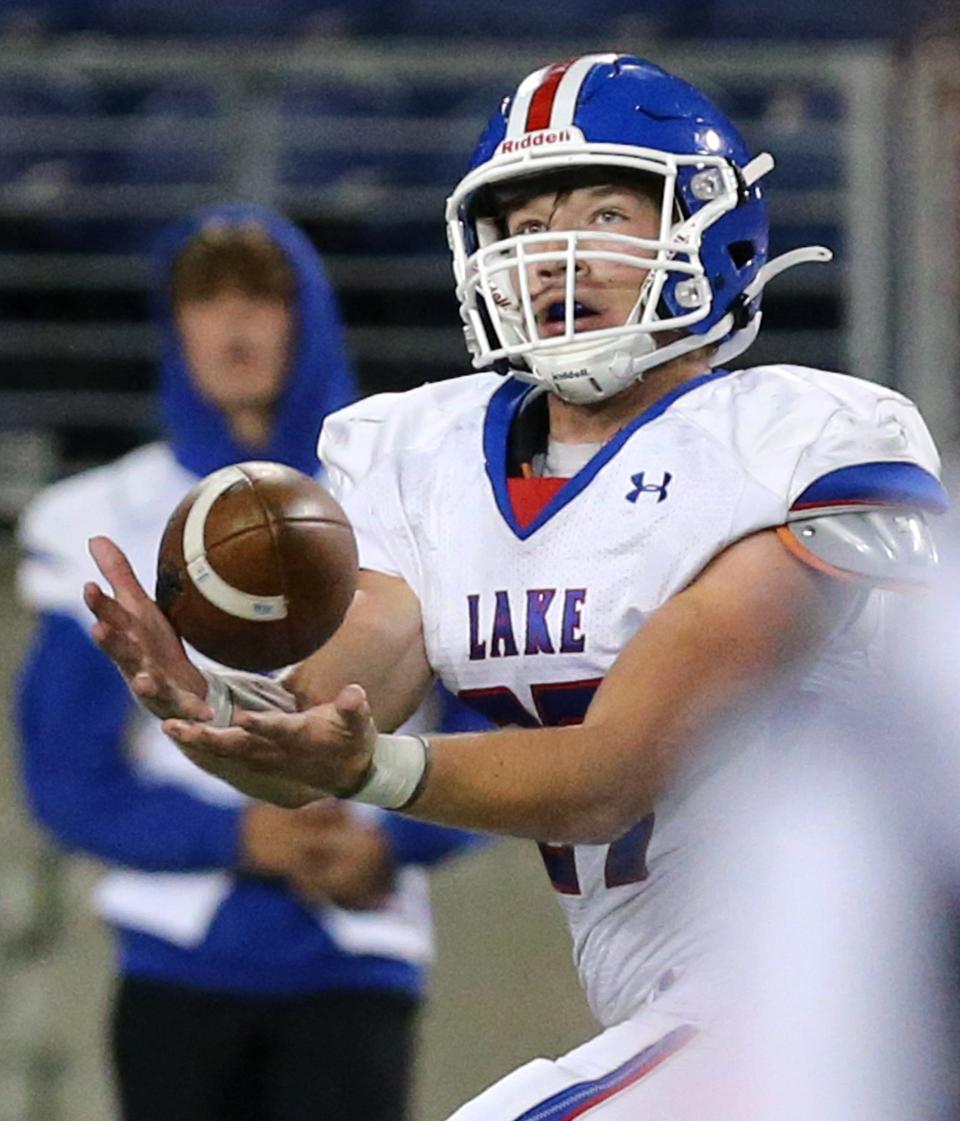 Logan Brady of Lake hauls in a deep touchdown pass during their game at McKinley on Friday, Oct. 1, 2021.