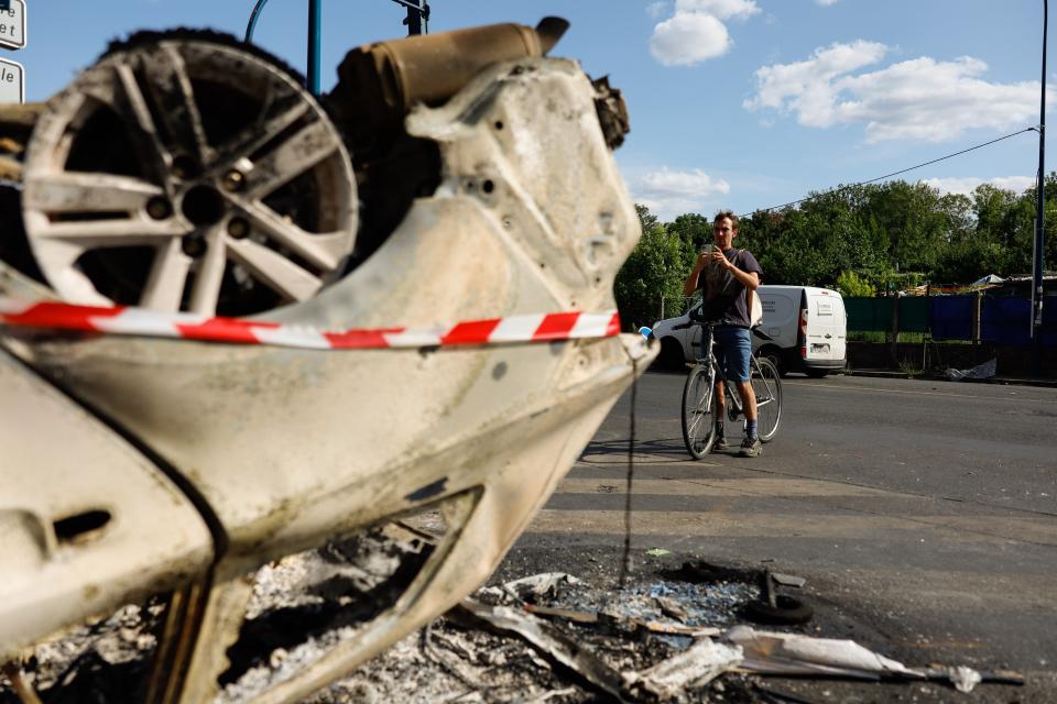 A car was damaged during night clashes between protesters and police in Aubervilliers in Paris (Getty Images)