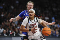 South Carolina guard Te-Hina Paopao, front, drives to the basket past Presbyterian guard Tilda Sjokvist during the second half of a first-round college basketball game in the women's NCAA Tournament in Columbia, S.C., Friday, March 22, 2024. (AP Photo/Nell Redmond)