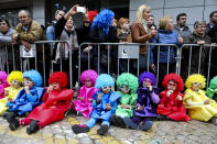 <p>Children dressed as clowns take a break from the children’s carnival parade in Torres Vedras, Portugal, Feb. 24, 2017. The Carnival of Torres Vedras features several parades with the children’s parade featuring elementary and middle school students wearing masks or costumes they have made themselves. (Photo: Mibuel A. Lopes/EPA) </p>