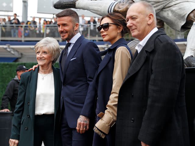 <p>Meg Oliphant/Getty</p> David Beckham with his wife Victoria Beckham and parents, Sandra West and Ted Beckham, March 2019.