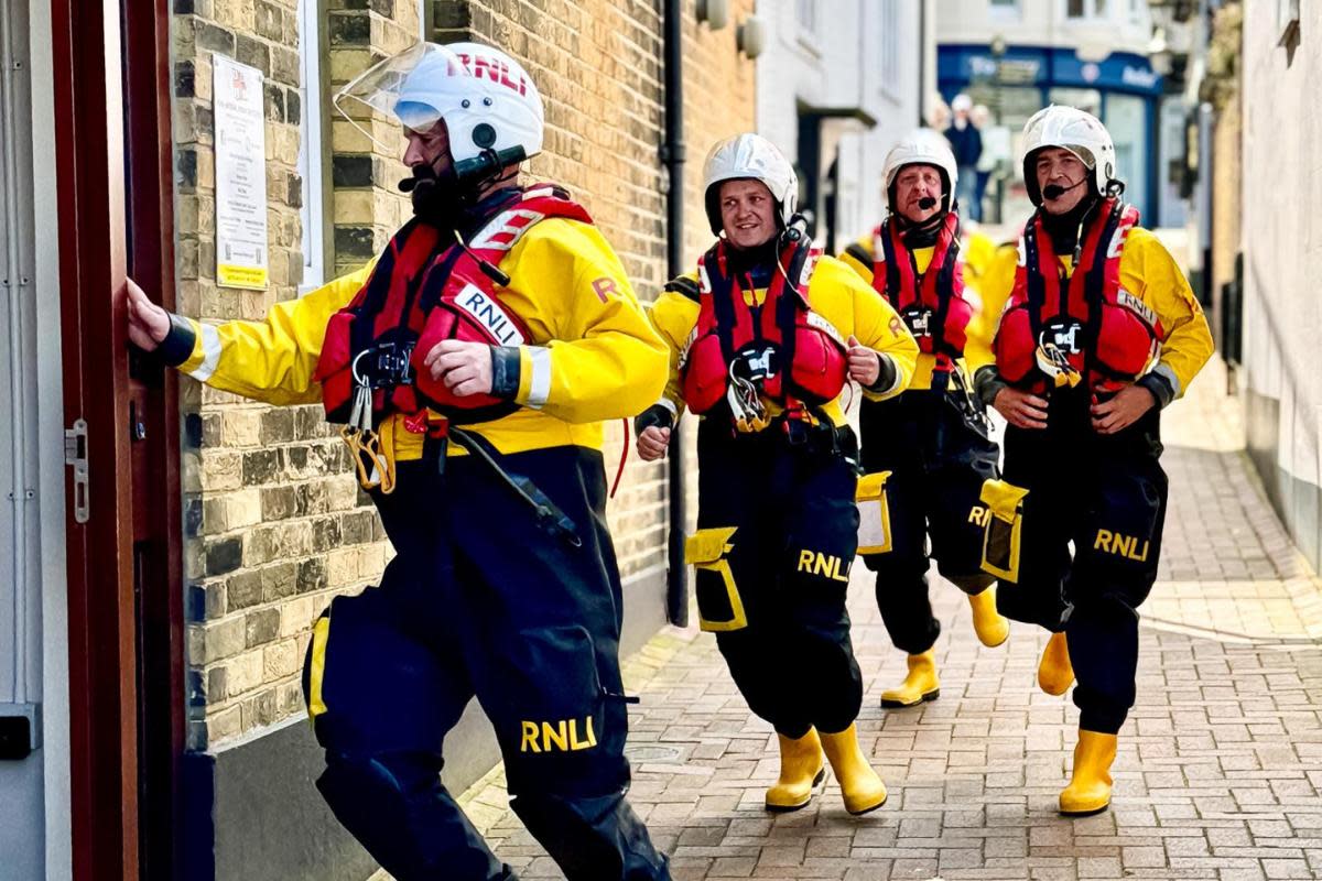 An exercise took place. Joshua Matthews, Willoughby Matthews, Mark Scholes and Anthony Stothard rush to the Lifeboat Station to the rescue of kayakers in trouble in the sea. <i>(Image: Pamela Parker)</i>