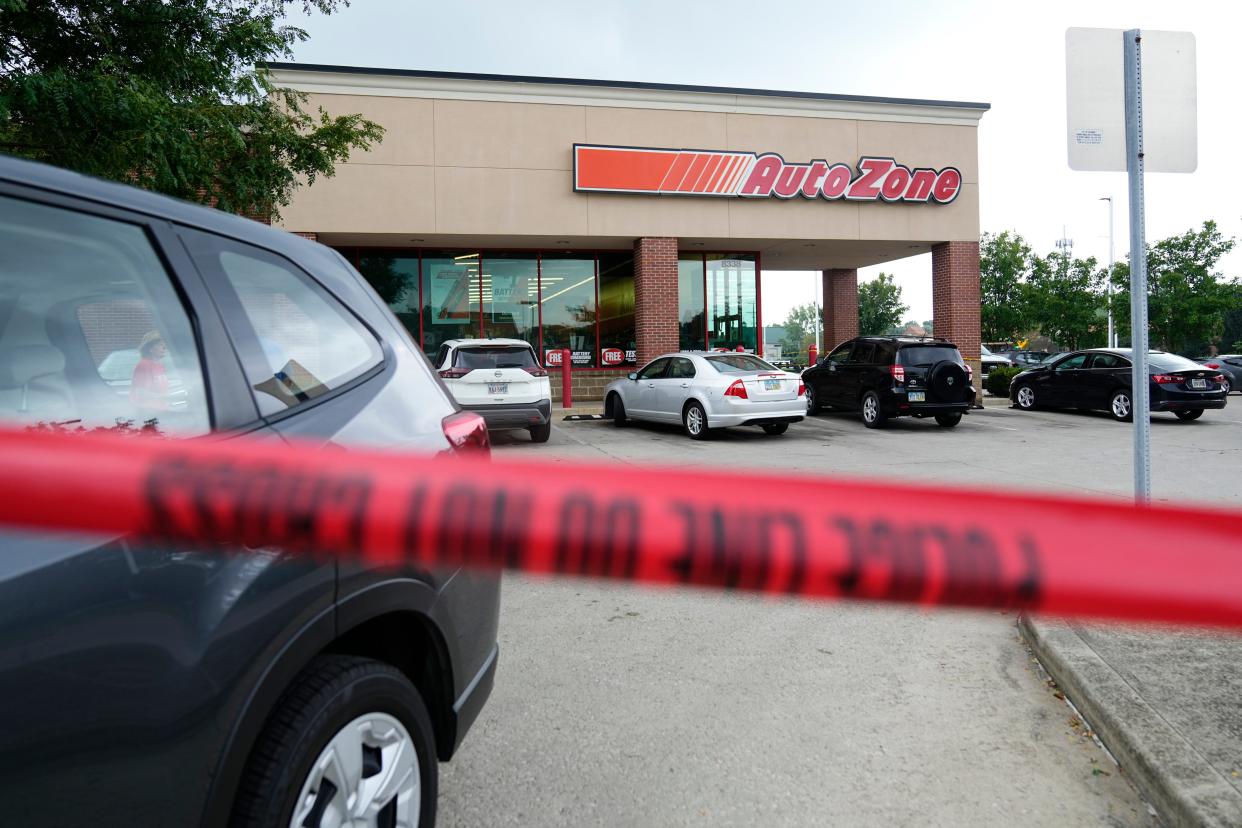 Crime scene tape lined the parking lot Friday, a day after a 43-year-old Columbus man was killed and an 18-year-old cashier was injured in a suspected armed robbery attempt at the AutoZone auto parts store at 8838 Sancus Blvd. on Columbus' Far North Side near Polaris mall.