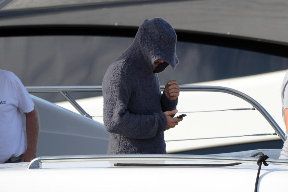 Leo with the hooded sweater aboard a yacht. (Photo: Splash)