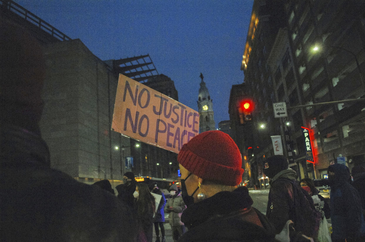 Protesters hold the street for seven minutes in honor of Christian Hall (Cory Clark / NurPhoto via AP)