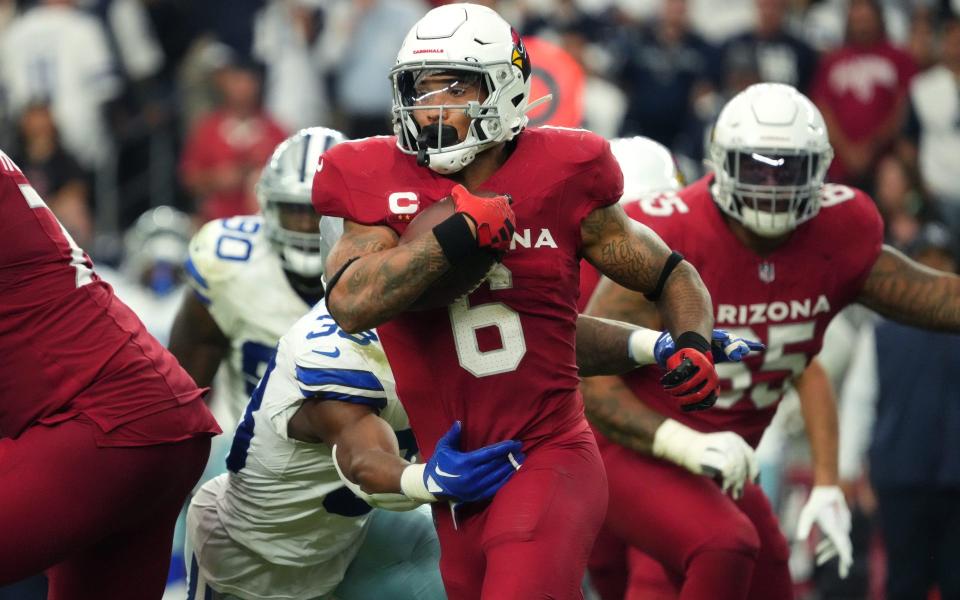 Sep 24, 2023; Glendale, Arizona, United States; Arizona Cardinals running back James Conner (6) carries the ball against the <a class="link " href="https://sports.yahoo.com/nfl/teams/dallas/" data-i13n="sec:content-canvas;subsec:anchor_text;elm:context_link" data-ylk="slk:Dallas Cowboys;sec:content-canvas;subsec:anchor_text;elm:context_link;itc:0">Dallas Cowboys</a> at State Farm Stadium.