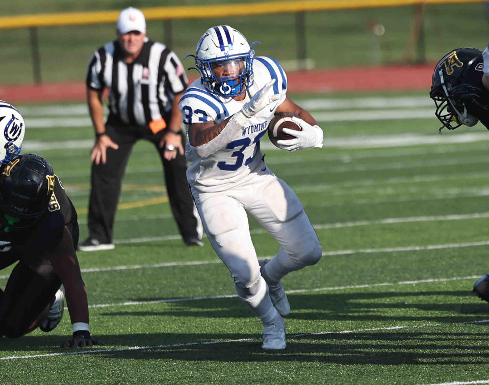 Wyoming running back C.J. Hester runs the ball during the football game between Taft and Wyoming high schools Friday, Aug. 26, 2022.