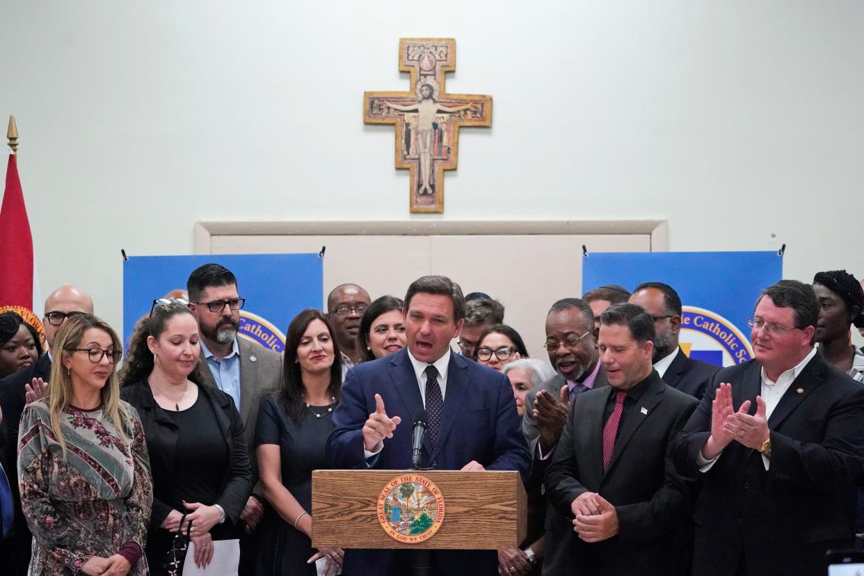 In May 2021, Florida Gov. Ron DeSantis speaks before signing a bill that increases eligibility to attend private schools at public expense. The ceremony was at St. John the Apostle School in Hialeah. The bill is projected to allow more than 60,000 previously ineligible students to seek vouchers. The cost to the state will be an estimated $200 million.