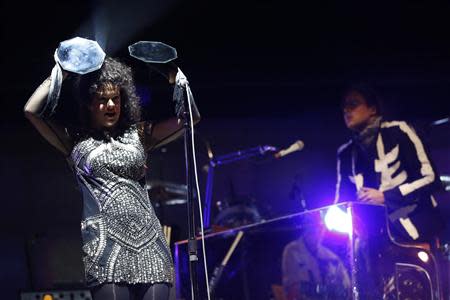 Singer Regine Chassagne and her husband lead vocalist Win Butler of rock band Arcade Fire perform at the Coachella Valley Music and Arts Festival in Indio