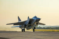 In this photo released by Russian Defense Ministry Press Service on Friday, June 25, 2021, a Russian MiG-31 fighter jet carrying a Kinzhal missile takes off from the Hemeimeem air base in Syria. The Russian military on Friday launched sweeping maneuvers in the Mediterranean Sea featuring warplanes capable of carrying hypersonic missiles, a show of force amid a surge in tensions following an incident with a British destroyer in the Black Sea. (Russian Defense Ministry Press Service via AP)