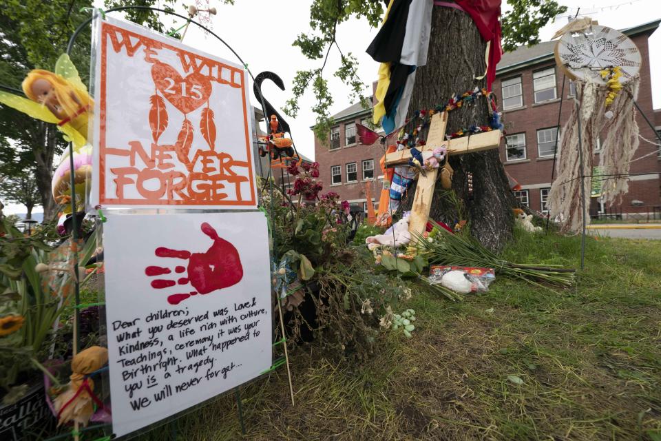 Signs at a memorial outside the Residential School in Kamloops, British Columbia.