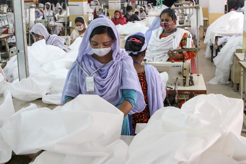 Protective suits being manufactured at a garment factory in Dhaka, Bangladesh.
