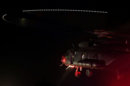 A military helicopter carrying rescued schoolboys approaches to land at a military airport in Chiang Rai, Thailand, July 9, 2018. REUTERS/Athit Perawongmetha