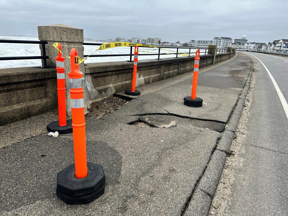 Damage at Hampton Beach along Ocean Boulevard from recent storms has town and New Hampshire authorities collaborating on a cleanup despite a longstanding dispute over responsibility for the sidewalks on Route 1A, a state road.