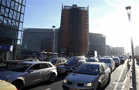 Cars are seen stuck in a traffic jam on a road near the European Commission headquarters during the morning rush hour in Brussels March 20, 2014. REUTERS/Francois Lenoir