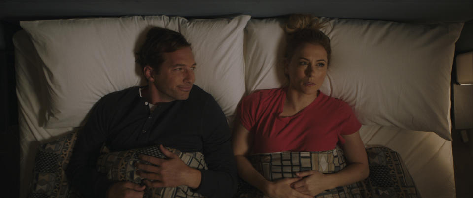 This image released by Netflix shows Ryan Hansen, left, and Iliza Shlesinger in a scene from "Good On Paper." (Netflix via AP)