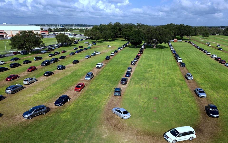 Residents queue in cars for testing