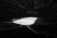 The Capital One Arena, home of the Washington Capitals NHL hockey club, sits empty Thursday, March 12, 2020, in Washington. The NHL is following the NBA's lead and suspending its season amid the coronavirus outbreak, the league announced Thursday. (AP Photo/Nick Wass)