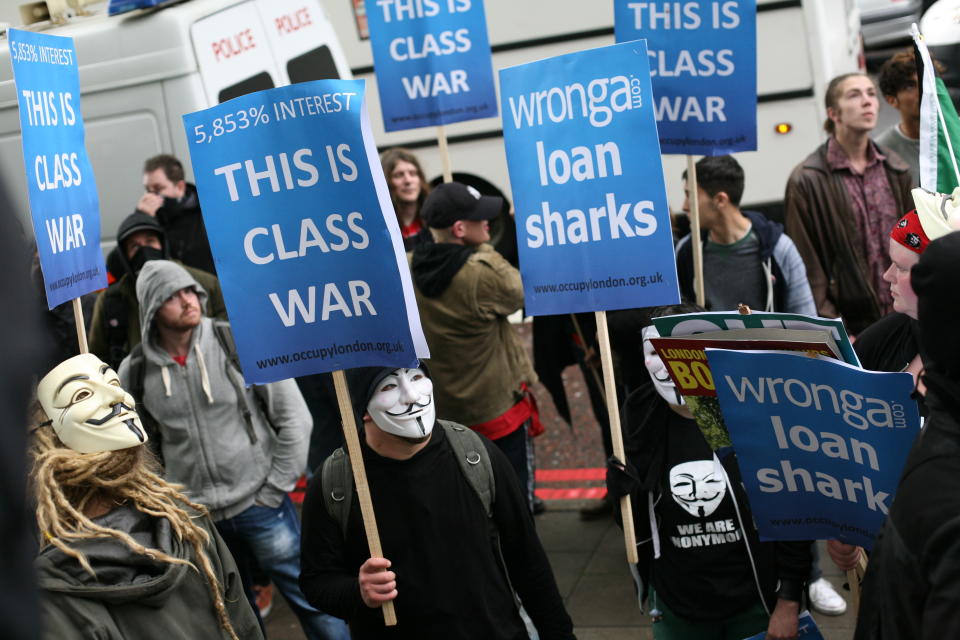 Occupy London organize a splinter march from the main May Day parade in London to protest against pay-day loan company, Wonga, in London, UK, on May 1, 2014. (Photo by Jay Shaw Baker/NurPhoto) (Photo by Jay Shaw Baker/NurPhoto/Corbis via Getty Images)