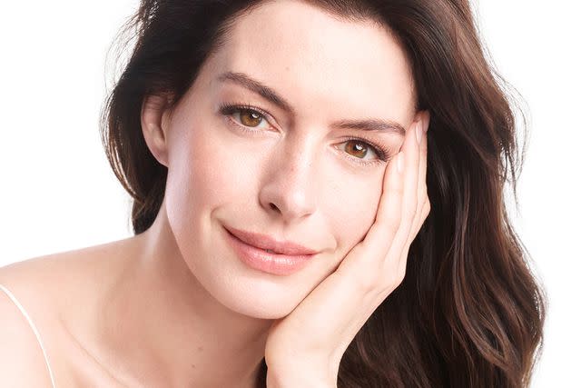 <p>Courtesy of Shiseido</p> Anne Hathaway poses for Shiseido.