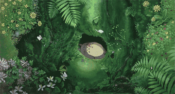 Totoro relaxes in a glade