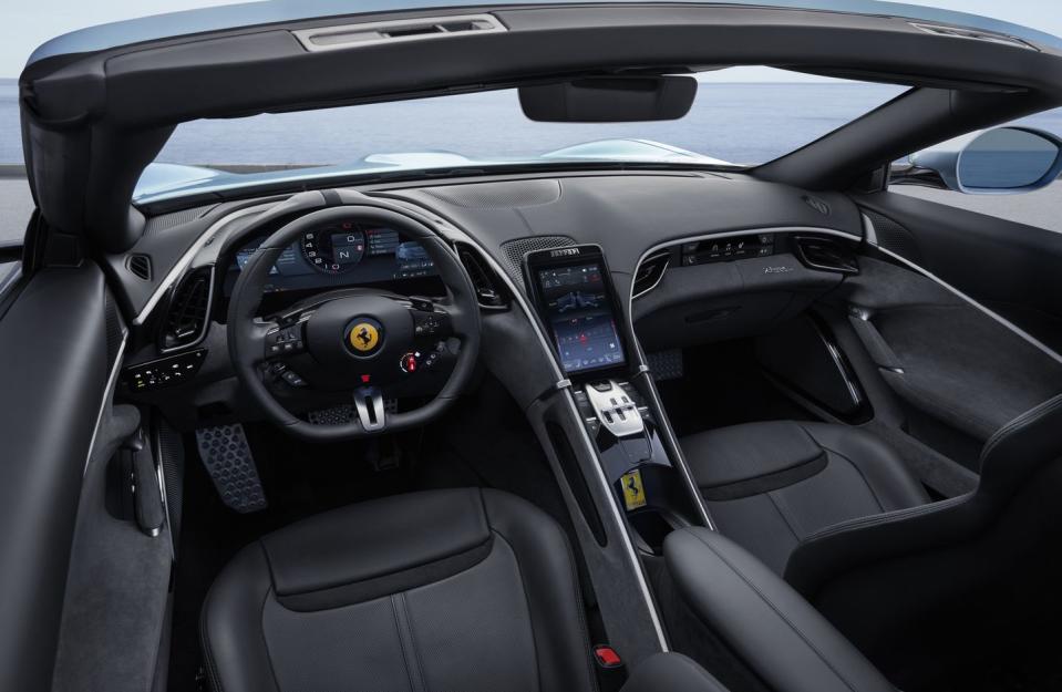 <p>The interior of the Roma Spider is pulled right from the standard coupe, and each front-seat passenger is cocooned by a sweeping dashboard that flows into the doors and floating center console.</p>