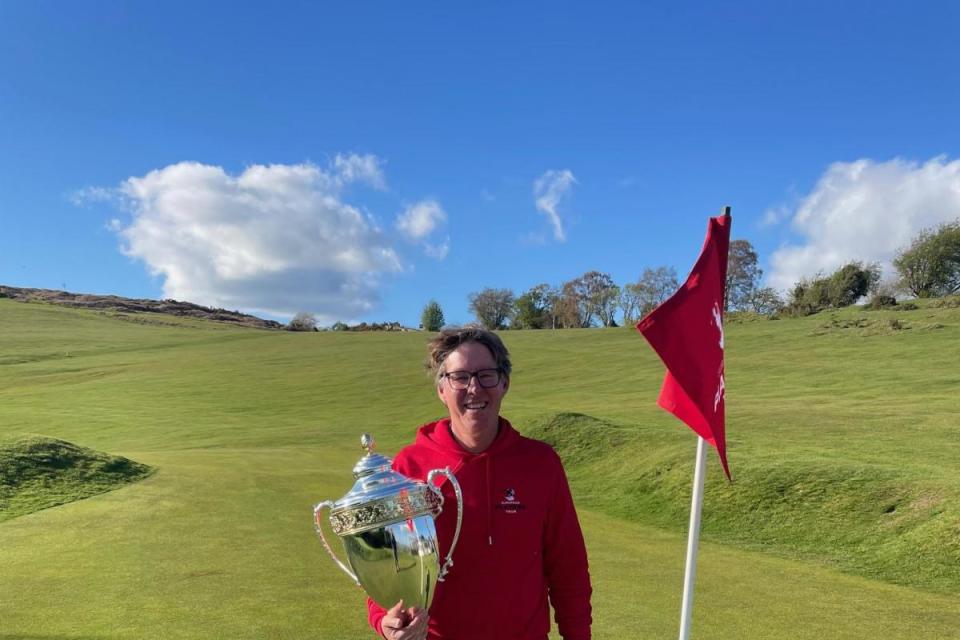 Former European Tour winner Carl Suneson pictured with the winner’s trophy on the 18th green. <i>(Image: Submitted)</i>