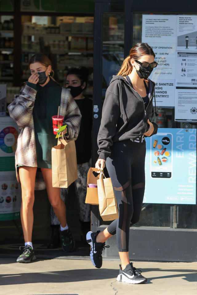 Kendall Jenner street style. Nike leggings, sports bra and a