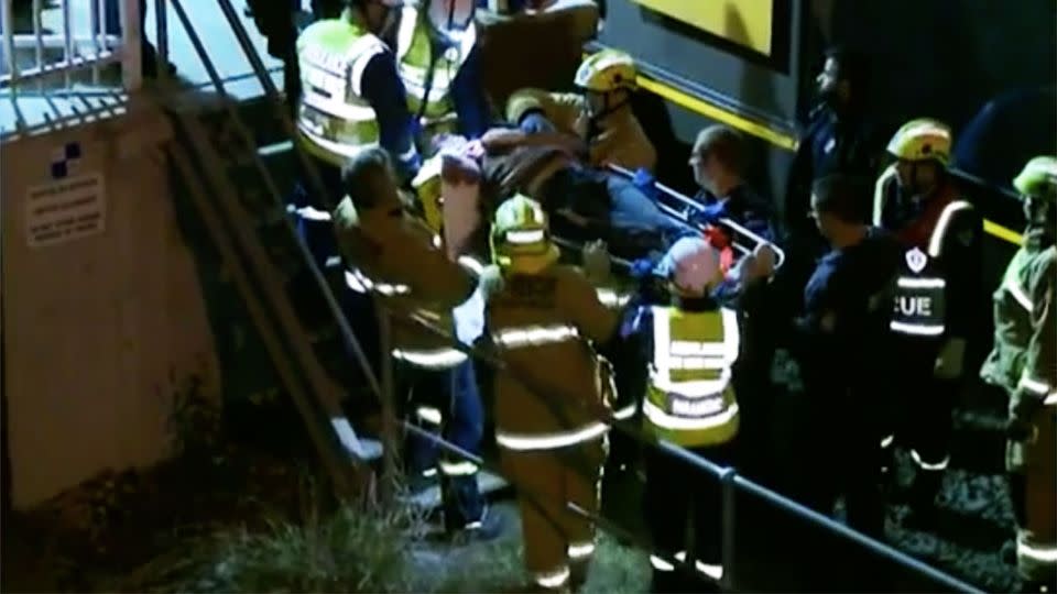 The 41-year-old's arm was severed off and it took authorities over an hour to free him from underneath the train. Photo: 7 News