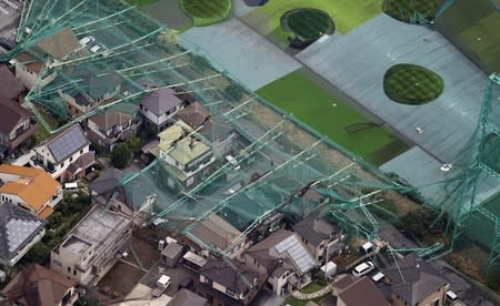 Houses damaged by a collapse of the perimeter netting of a golf training field due to strong winds of Typhoon Faxai are seen in Ichihara