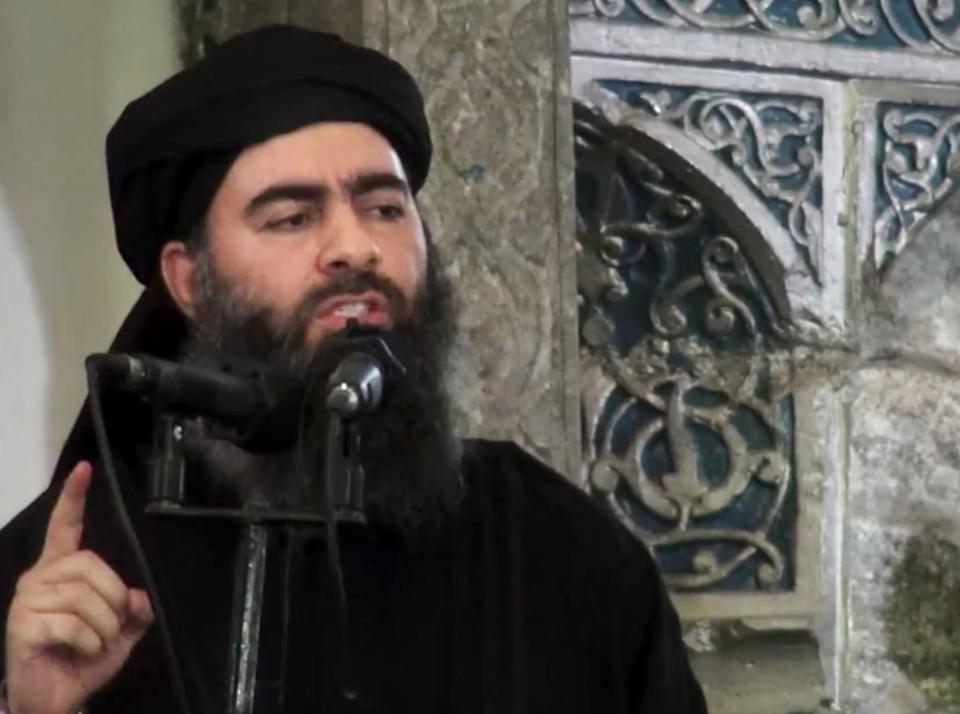 FILE - This file image made from video posted on a militant website Saturday, July 5, 2014, purports to show the leader of the Islamic State group, Abu Bakr al-Baghdadi, delivering a sermon at a mosque in Iraq during his first public appearance. The leader of the Islamic State militant network is believed dead after being targeted by a U.S. military raid in Syria. A U.S. official told The Associated Press late Saturday, Oct. 26, 2019, that Abu Bakr al-Baghdadi was targeted in Syria’s Idlib province. (AP Photo/Militant video, File)