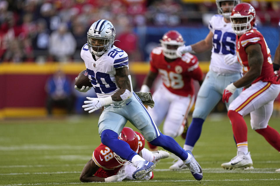 Dallas Cowboys running back Tony Pollard (20) runs with the ball during the first half of an NFL football game against the Kansas City Chiefs Sunday, Nov. 21, 2021, in Kansas City, Mo. (AP Photo/Charlie Riedel)