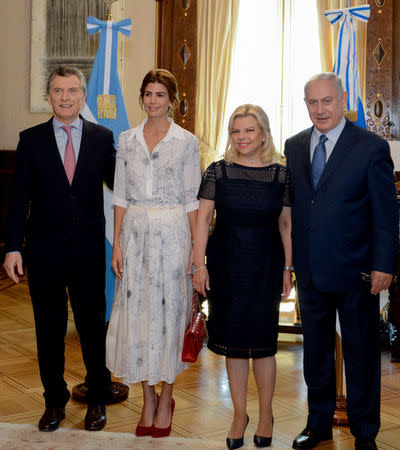 Israeli Prime Minister Benjamin Netanyahu and his wife Sara pose alongside Argentina's President Mauricio Macri and first lady Juliana Awada during a meeting at the Casa Rosada Presidential Palace in Buenos Aires, Argentina September 12, 2017. Argentine Presidency/Handout via REUTERS