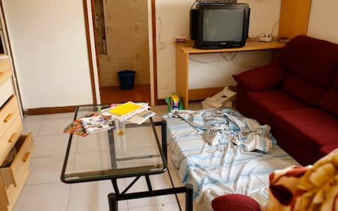 A mattress lies on the floor in an apartment where neighbours said an Imam lived after the police raided and searched the flat in Ripoll - Credit:  Francisco Seco/AP