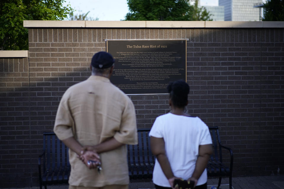 Demetrius Boyd, left, and Loretta Boyd visit the John Hope Franklin Reconciliation Park, Wednesday, May 26, 2021, in Tulsa, Okla. The two, from Tulsa, visited the park memorializing the Tulsa Race Massacre ahead of the 100 year anniversary. "History and education, and you have a sense of calmness and peace," said Demetrius Boyd about visiting the park for the first time. (AP Photo/John Locher)