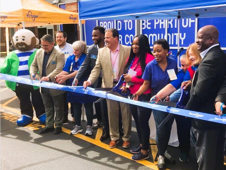 Atlanta Division President Victor Smith, far right, joined others to cut a ribbon for the store's expansion.