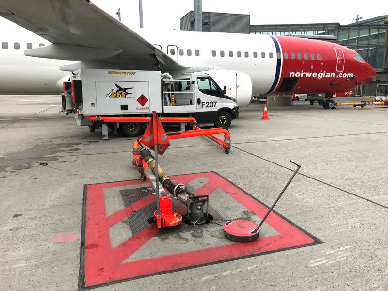 FILE PHOTO: A Norwegian Air plane is refuelled at Oslo Gardermoen airport