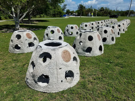 FILE PHOTO: Some of the 66 Eternal Reef balls with plaques representing each of the submarines and crewmembers lost at sea since 1900, which will be deployed to the ocean floor for the undersea memorial during a ceremony this Memorial Day weekend, off the coast of Sarasota, Florida U.S., May 23, 2018. Brian Dombrowski/EternalReefs.com/Handout via REUTERS/File Photo